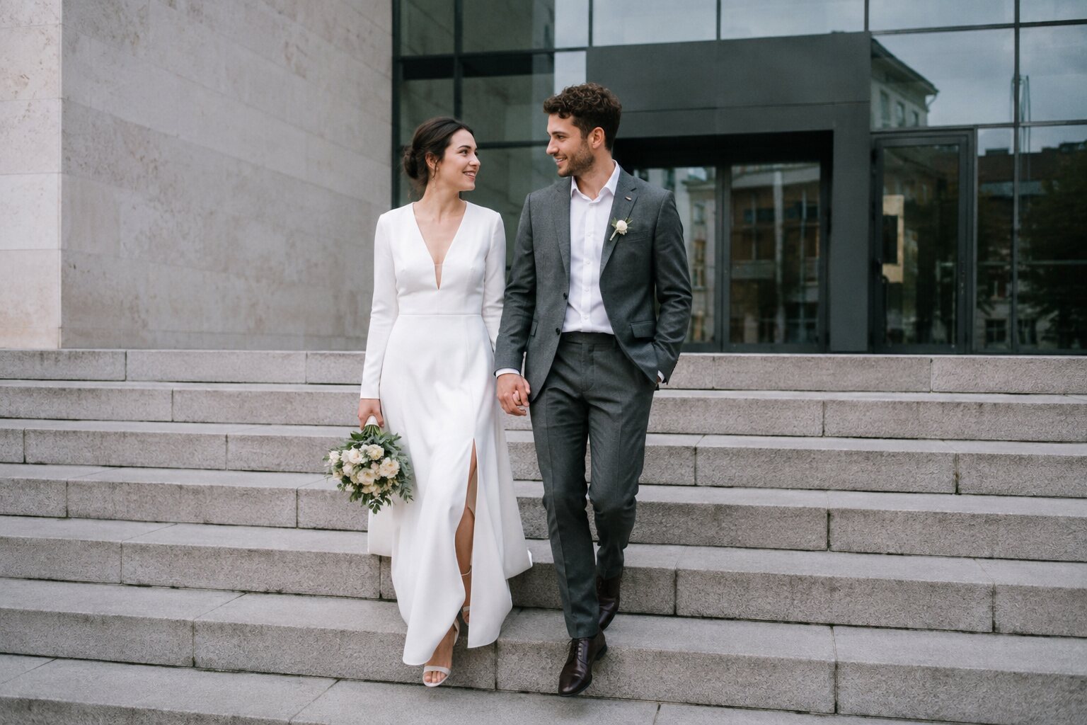 A couple sharing an unguarded moment outside their ceremony